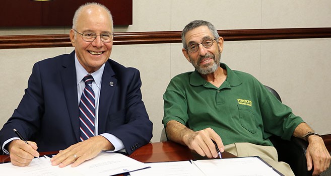 President Harvey Kesselman, left, and Michael Frank, professor emeritus.