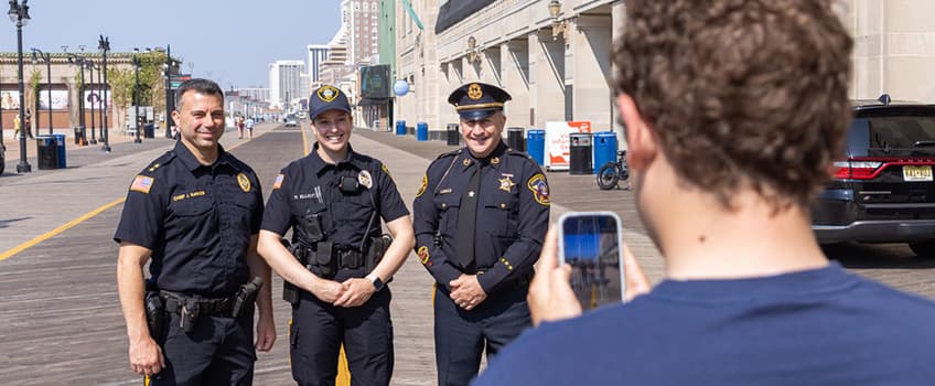Atlantic City Police Chief James Sarkos, new Class II officer Hannah Ellicott and her father Mitch Ellicott