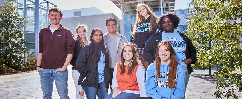 students smiling outside at galloway campus