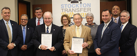 Stockton President Harvey Kesselman and Ocean County College President Jon Larson with members of the Stockton and OCC staff.