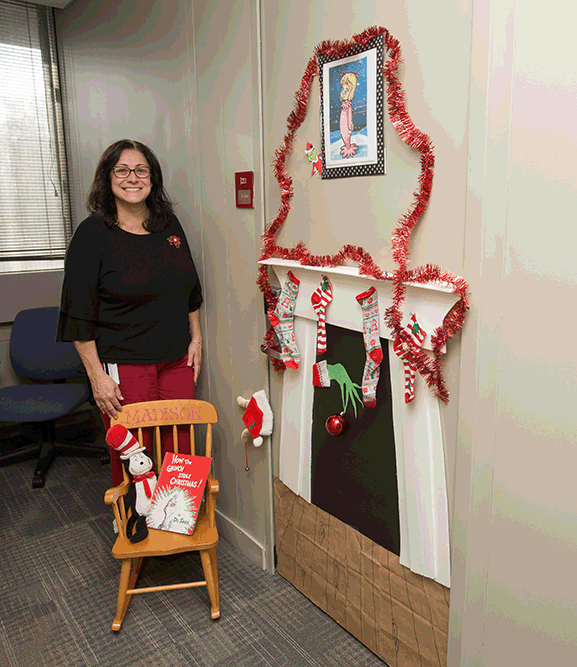 woman smiling in front of door