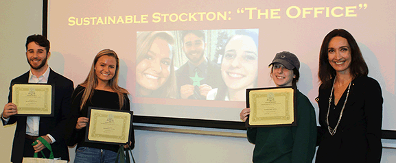 Students Christian Dugan, Amanda Klapatch and Theresa Evoy with Assistant Professor of Business Studies and Marketing Naz Onel