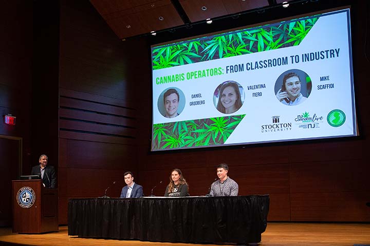 Three students on a panel