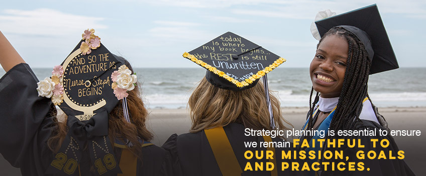 Stockton graduates on the beach in Atlantic City