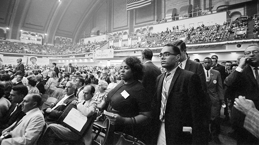 Robert P. Moses and Fannie Lou Hamer observed the crowd at the Democratic National Convention in August 1964. Photo courtesy of George Ballis/ Take Stock. 