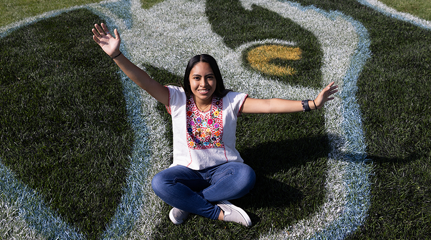 Katie Mendoza on the lawn of the Stockton University Campus Center