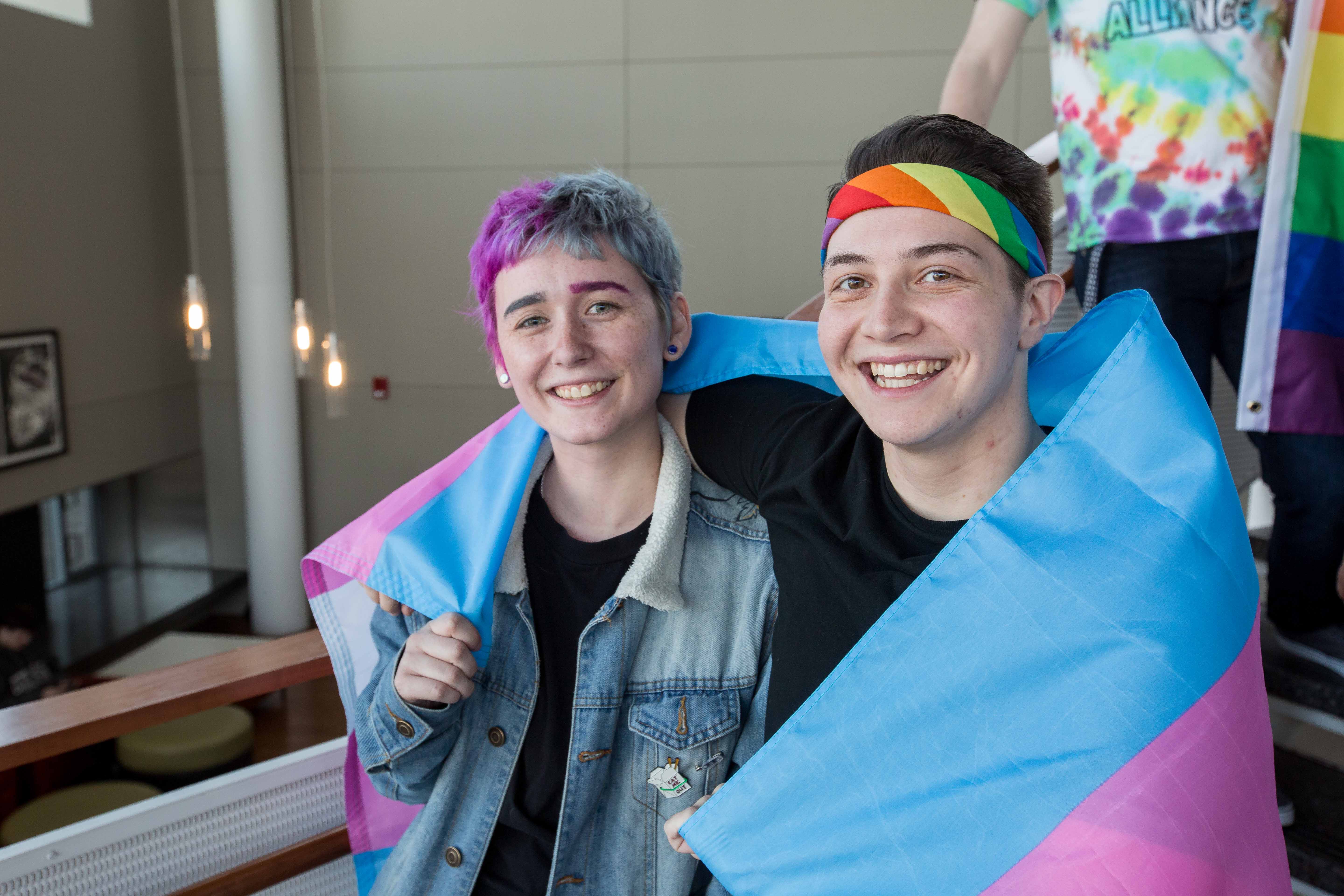Two students wrapped in Trans Flag